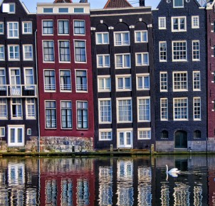 Amsterdam's famous narrow buildings. Photo via Flickr:pasotraspaso