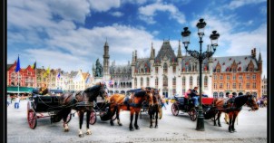 Horsedrawn carriages in Bruges. Photo via Flickr:Wolfgang Staudt
