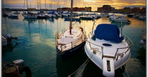 Boats in Normandy harbor. Photo via Flickr:Moyan Brenn