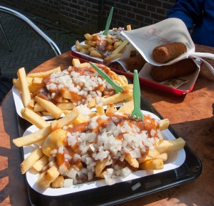 Dutch fries with curry ketchup, onions and "kroketten"
